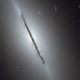 The disk galaxy NGC 5866 is seen almost perfectly on-edge.